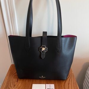 kate spade Black Kaci Tote with Pink Interior and Floral Clasp